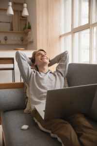 photo of man sitting on sofa